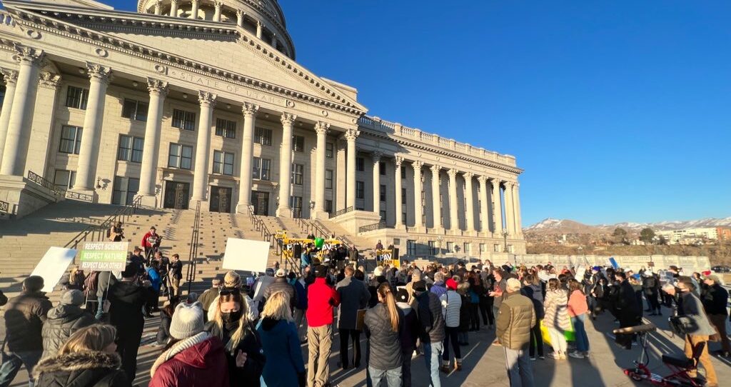 Utahns gathered outside the Utah State Capitol building at a protest